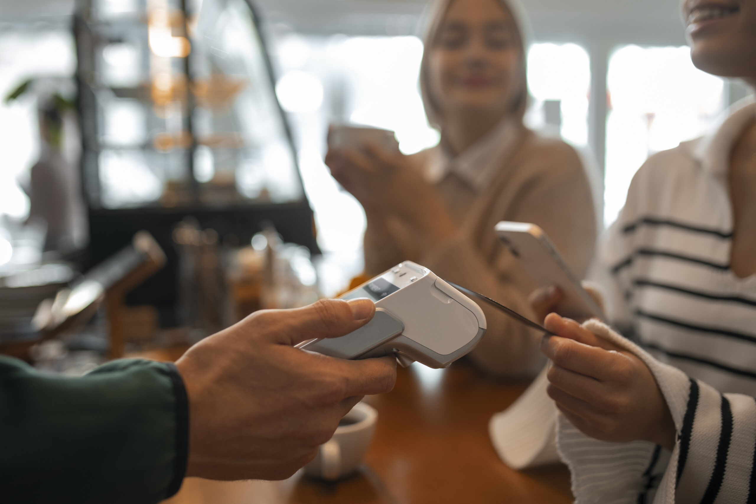 person-using-nfc-technology-pay-restaurant